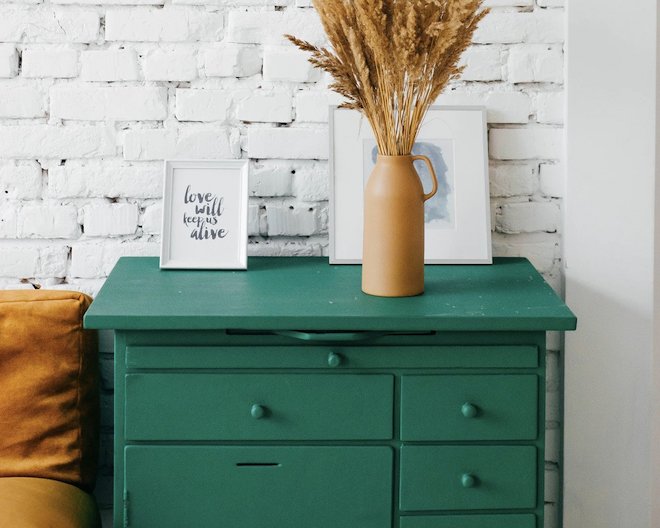 green drawers in front of white wall
